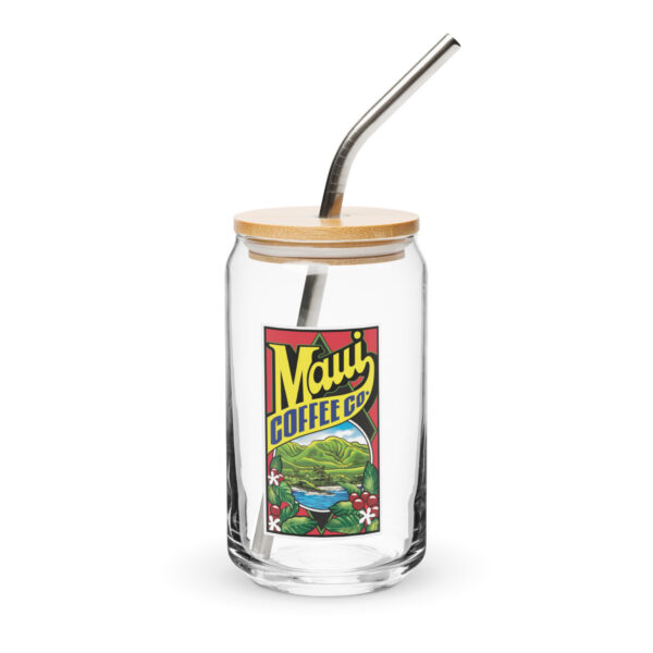This 16 oz Logo Glass Cup features a clear glass body with a bamboo lid and metal straw, and is adorned with a vibrant Maui Coffee Co. label showcasing scenic mountains, lush greenery, and colorful flowers.