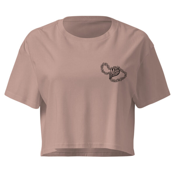 The Women’s Lei Crop Top is a mauve cropped t-shirt featuring a small black floral chain graphic and “Milly” text on the left chest, with short sleeves and a crew neckline.